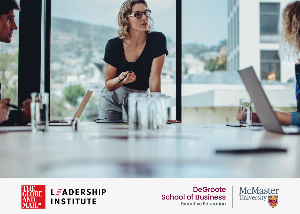 A professional leading a meeting in an office.