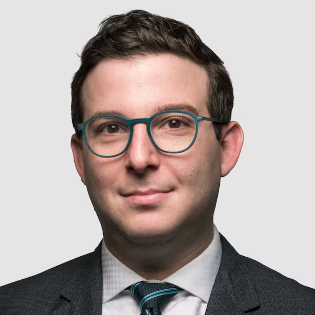 Headshot of Jameson Berkow wearing a suit and tie
